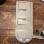 2004-2012 Nissan Titan Armada QX56 Front Overhead Console Storage Beige Oem. Fixed Price $140.00.
